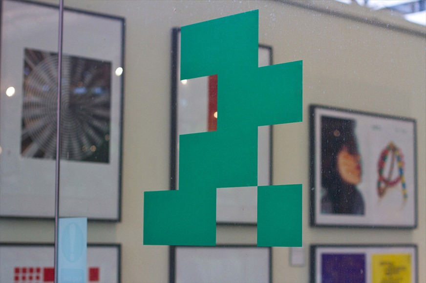Green geometric graphics on gallery window